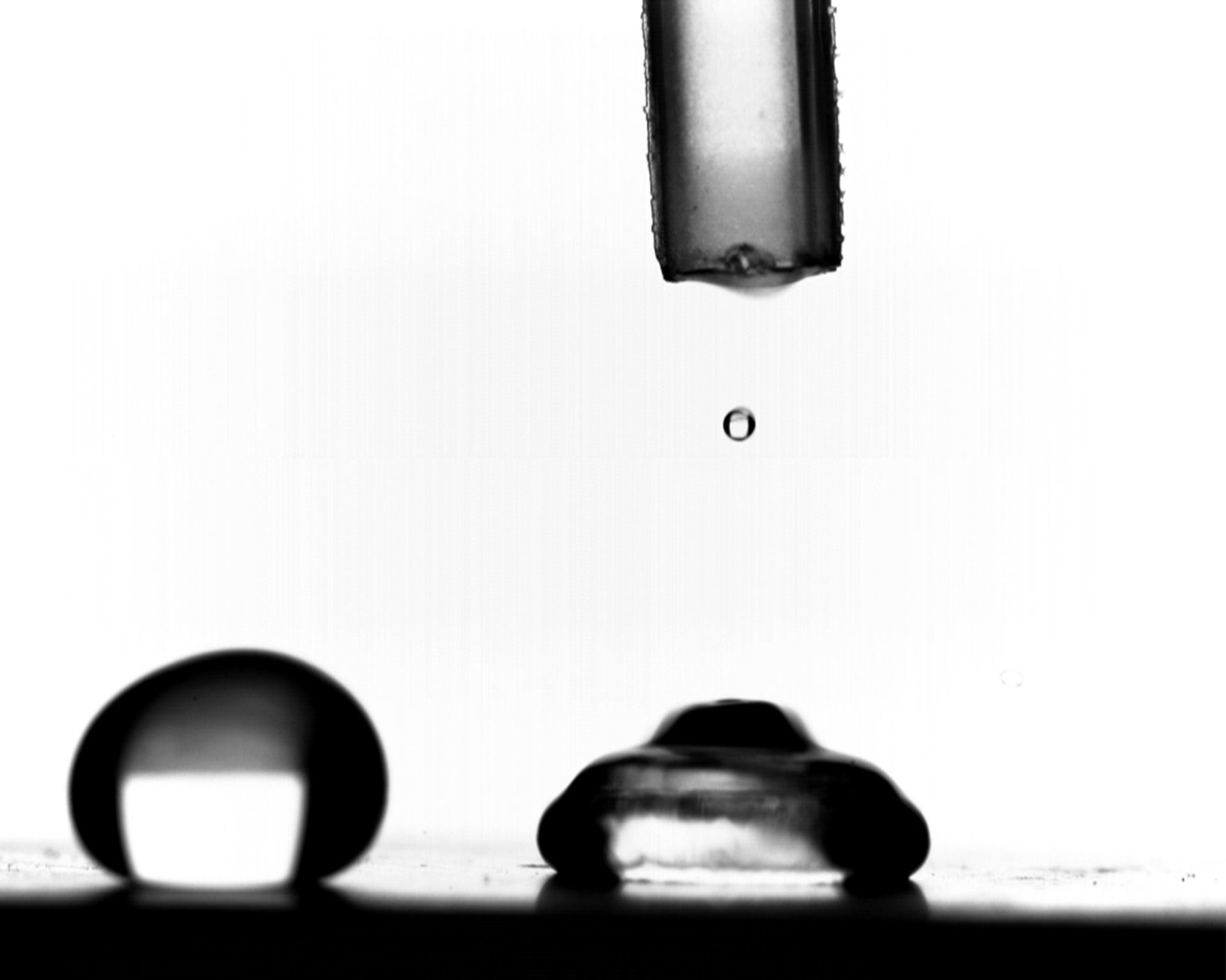 Study of Droplet Impact on Heated Superhydrophobic Materials with High-Speed Camera