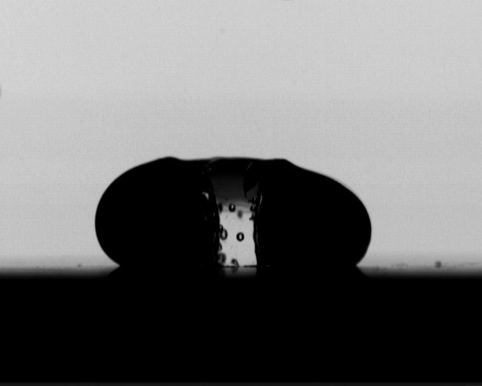 Study of Droplet Impact on Heated Superhydrophobic Materials with High-Speed Camera