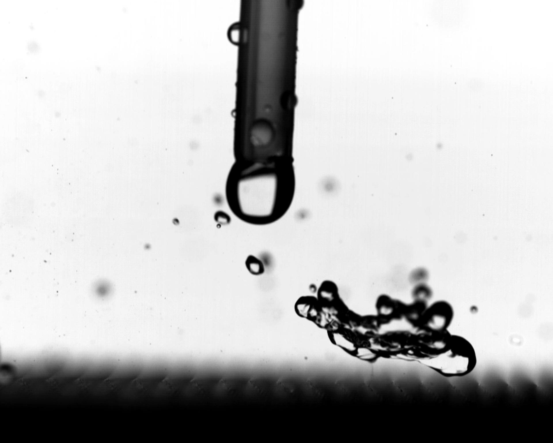 Study of Droplet Impact on Heated Superhydrophobic Materials with High-Speed Camera
